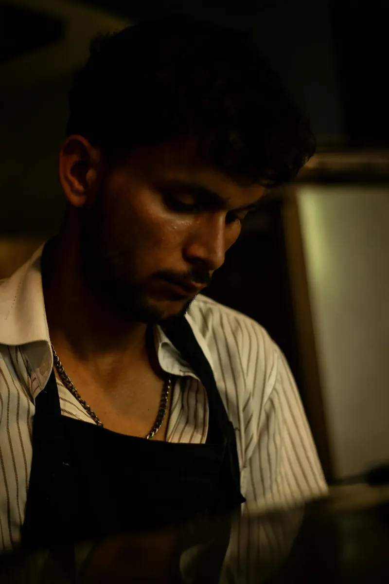 A woman with long hair standing in a park