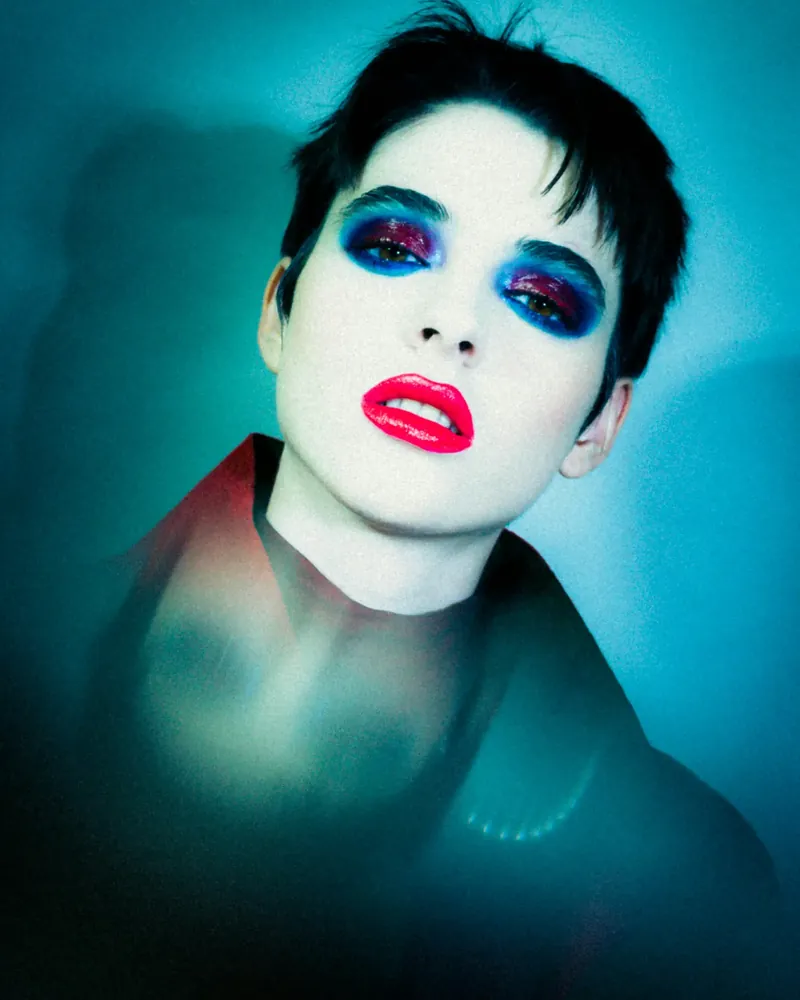 Woman looking through a camera viewfinder